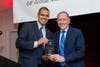 Jason Young (l), Waterway Carwash, accepts the award for Corporate Citizen of the Year from Harley Korman.