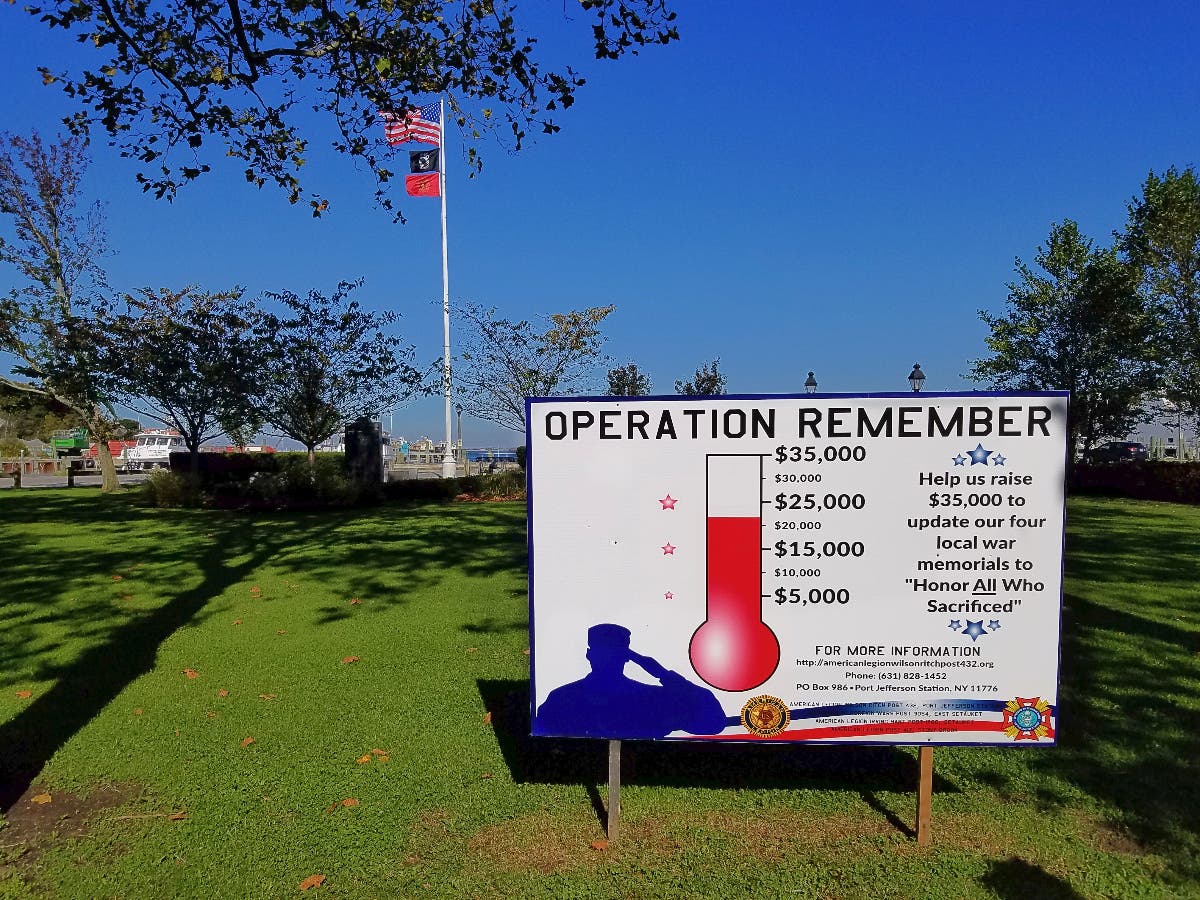 A sign installed near a Port Jefferson veterans memorial reminds passersby of the continuing work to update sites in Port Jefferson, Setauket and Stony Brook for recent military operations.  