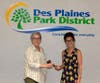 Erin Doerr (R) passes the gavel to incoming Park Board President Jana Haas at the May 16, 2023 Des Plaines Park Board meeting.