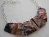 “Crumpled II” by Diana Papazian, sterling silver and copper necklace, 19" across, adjustable length