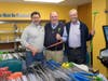 Volunteers Joe Tomei, Tom Leghorn and Doug Gould fitted mini-golfers with their clubs.