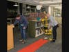 Mini-golfers tee off in the stacks at the NRPL Foundation's 
"Game On" event.