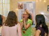Children's librarian Joy Farmer reacts to seeing herself portrayed in the exhibit.