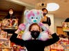 A Maple Student Council member holds up a teddy bear that was donated to Youth Services' annual holiday Toys for Tots collection.