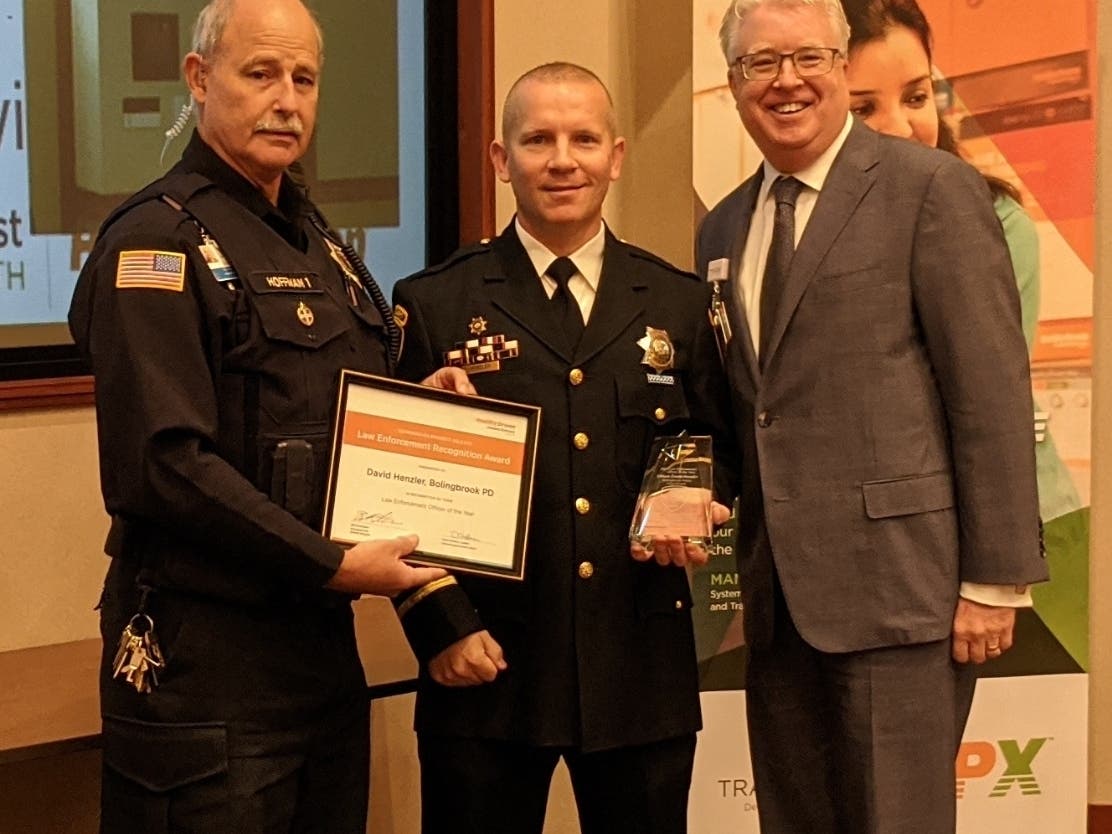 Bolingbrook Police Officer David Henzler (center) with Dave Hoffman (left), Manager, Public Safety, Edward Hospital and Joe Dant, President & CEO, Edward Hospital.