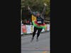Mary Kate Ternberg of Geneva celebrates as she finishes the Healthy Driven Naperville 5K with a time of 28:18.