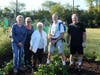 Woodridge Garden Club members and Woodridge residents Janet Simpson, Elaine Renfus, Kathy Nartnick, Larry Simpson, Paul Wisdom working at the park district garden plots. 