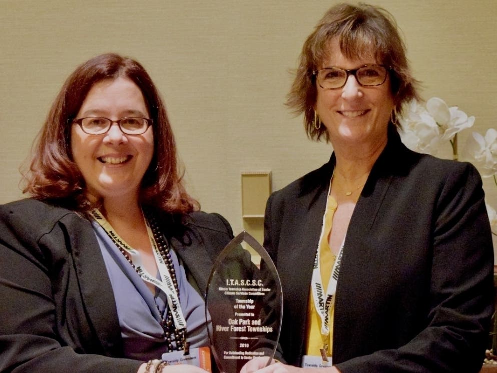 Township Senior Services Director Pamela Mahn (left) and River Forest Township Supervisor Carla Sloan hold the award at the Township Officials of Illinois conference.