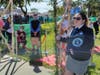 Last September, Guinness World Records adjudicator Claire Elise Stephens, deploying a hand counter, observed the dog couples as they made their way under the wedding arch and into the ceremony area at Lions Park in Villa Park.