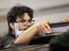 NIU mechanical engineering student Salomon Ramos works on the ICECHIP project last Friday. Contributing to the world’s largest ever coordinated effort to study hail, he's on the team that is simulating the force impacts of hail.
