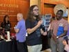 Rudy Ruelas II speaks with visitors to the SafeStride Robotics' booth at DePaul. NIU faculty member Peter Lin lauded Ruelas and fellow engineering student Han Ju, noting they "exemplify the spirit of student entrepreneurship.”