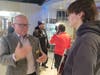 CEET Dean Dave Grewell speaks to a high school student during the expo. Later, as panel moderator, he emphasized "there's no industry out there that doesn't need engineers.”