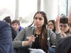 A Guilford High School student poses one of many thoughtful questions that were directed to the panel. Students from across the region — including Rockford East, Guilford, Harlem, Belvidere, North Boone and Hononegah high schools — filled the atrium.