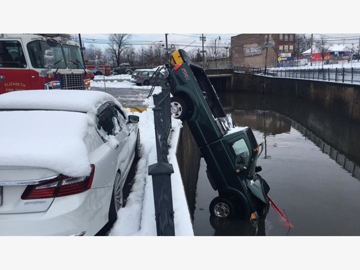 News media were on the scene capturing the event after the tow truck reportedly crashed through a gate.