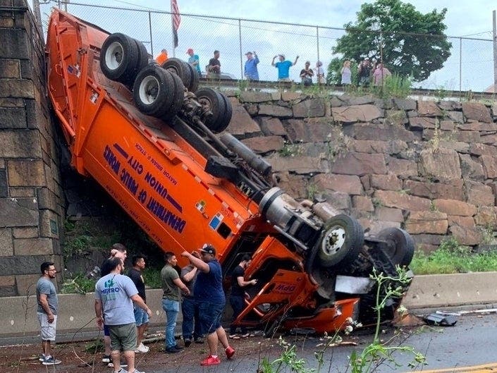 A truck overturned near the Lincoln Tunnel in New Jersey on July 3, 2019.