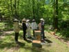 Mike Banker,  bee expert  and beekeeper, of Eco Bee Supply installing the hives on the TBA property as well as explaining the process to Eagle Scout and TBA member Casey Dutch and  members of his scout troop., BSA Troop 15 , Short Hills