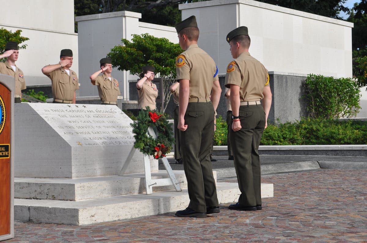 YM SgtMaj Angel Orozco (right) performs a wreath laying in Pearl Harbor.