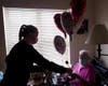 Kara Rauhut Timbers CNA passes out a special Valentine’s Day surprise to resident Rita Zobran. Families of residents, Timbers’ neighbors and local businesses purchased packages for residents. 