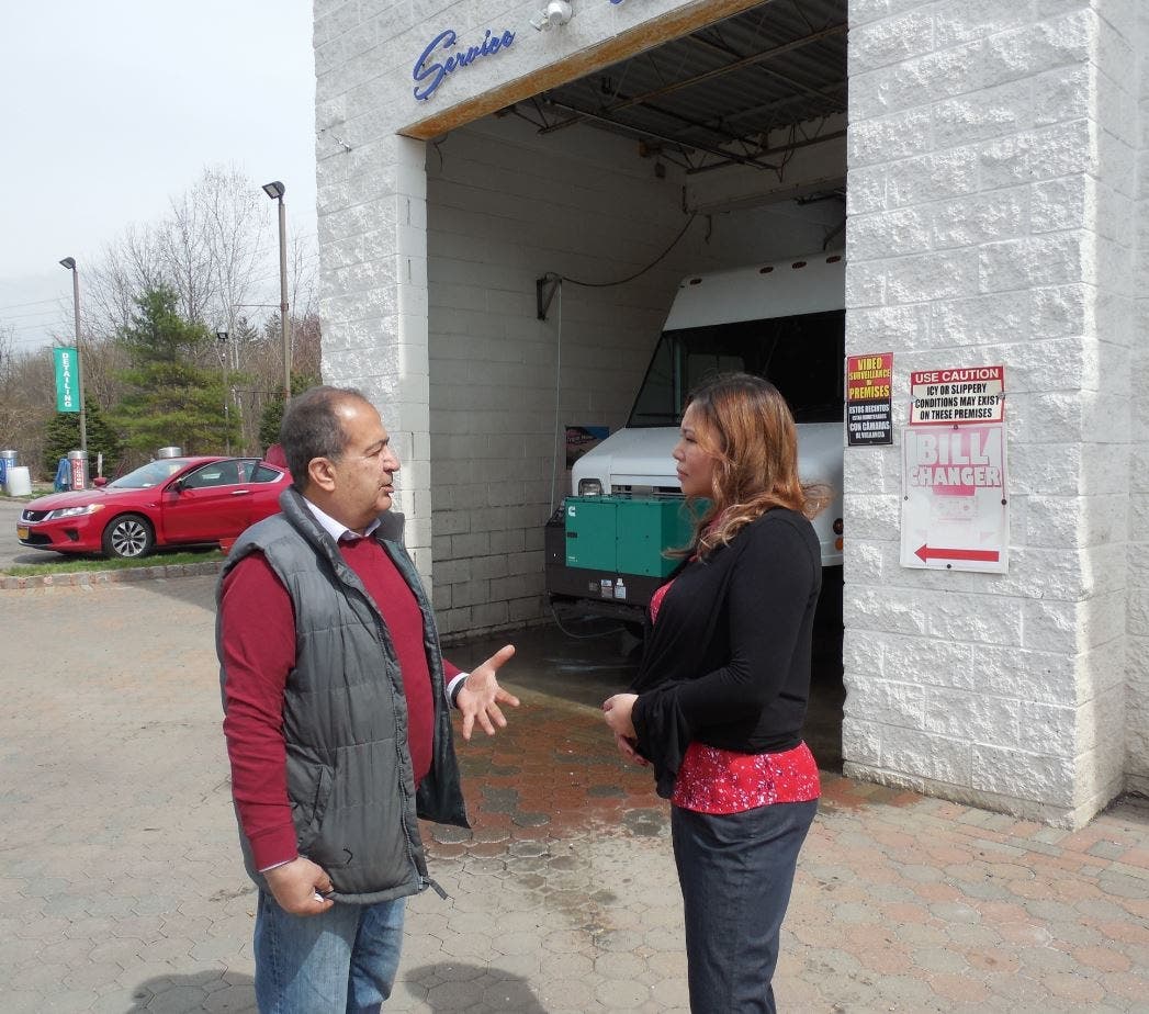 Raymond Ahmadi, at his carwash in Pearl River, discusses the phone scam with O&R’s Shoko Saito, who saved him.