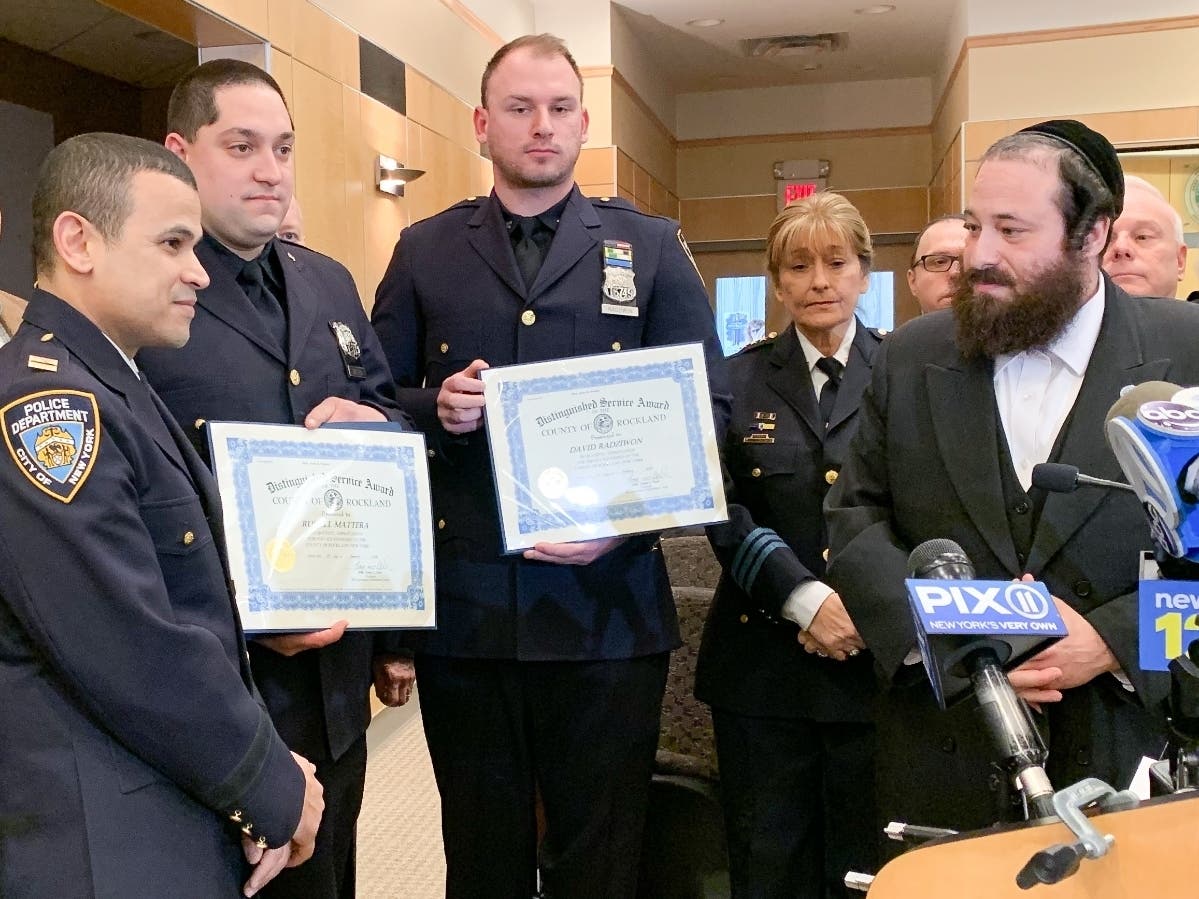 In a ceremony hosted by Legislator Aron Wieder, NYC officers Russell Mattera and David Radziwon were thanked for arresting the alleged Hannukah attacker.