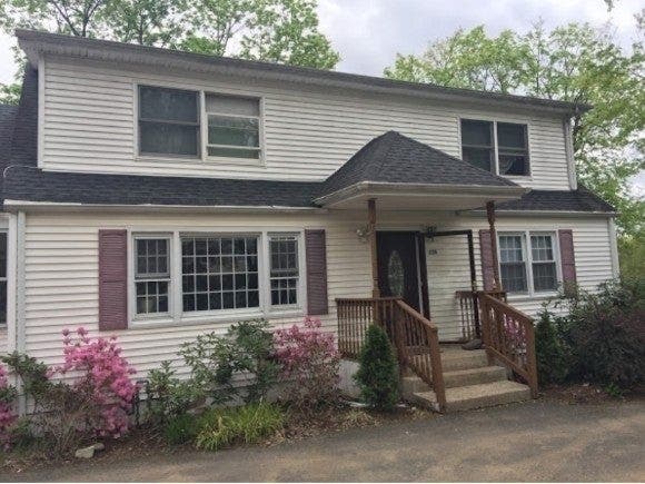 The Senate's action was based on a report on code enforcement that included this example of single-family houses illegally converted for many tenants. 