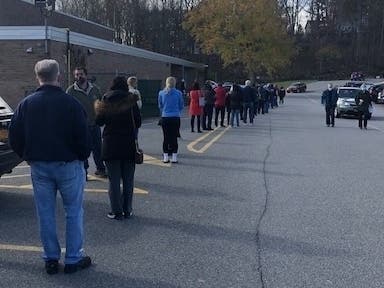 Voters stayed socially distanced outside a polling place Nov. 3, 2020.