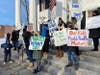Members of Reopen Putnam Schools held a rally Thursday on the steps of the historic courthouse.
