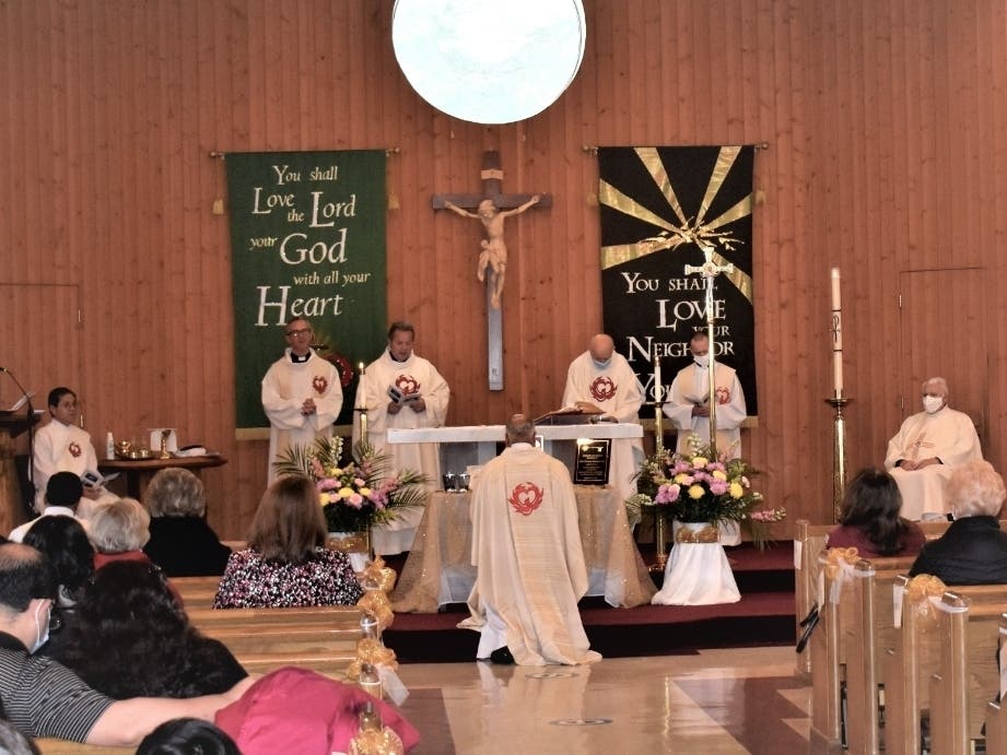 Two newly merged parishes installed a new pastor Feb. 14.