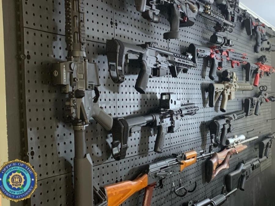 A wall of weapons was found at the home of Airmont's deputy mayor, arrested after a search warrant was executed Thursday.