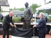 William K. Nelson, retired justice for the Rockland County Supreme Court, and County Executive Ed Day unveil the Thurgood Marshall Human Rights Monument in New City.