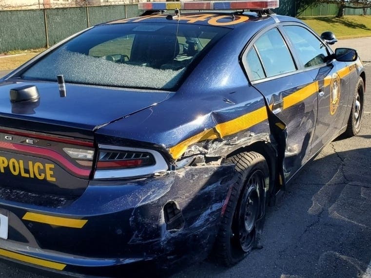 State police said a Bronx man accused of driving drunk hit a patrol car while the troopers were interviewing another Bronx driver they determined was intoxicated.