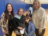 Alana Newman and Megan Cappiello welcome a Lakeview Elementary family. 