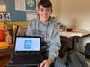Griffin Vennard with the card he got 100 Mahopac Middle School sudents and staff to sign for seventh grade math teacher Dorothy Myler. 