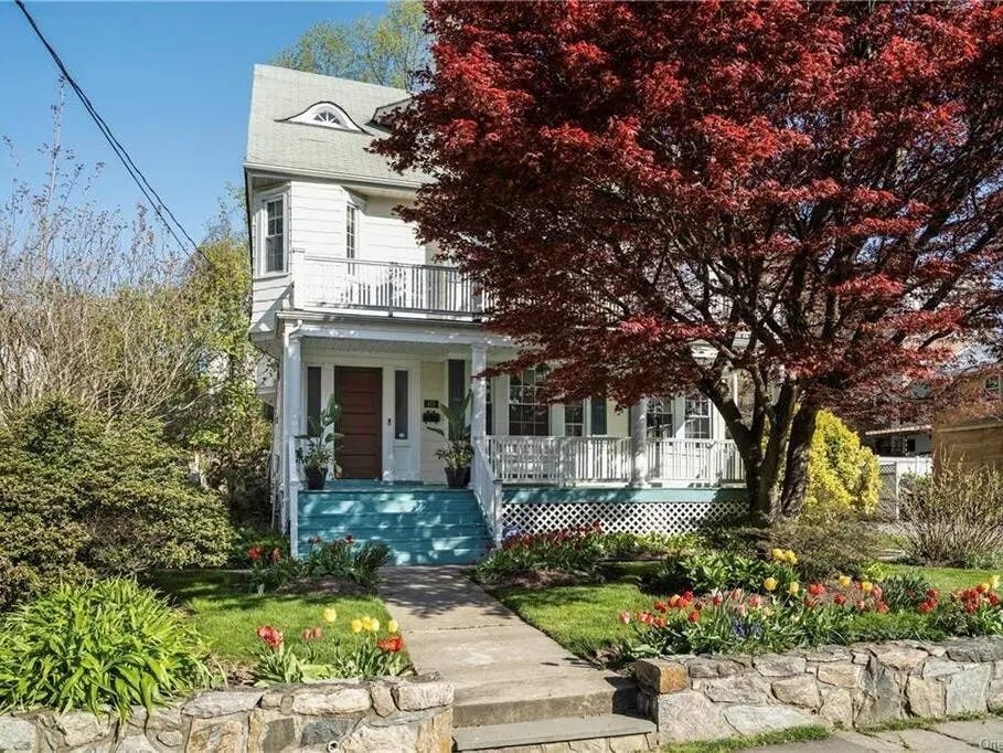 You can tell from the sidewalk that this Dutch Colonial-style house in the historic Heathcote neighborhood is special.