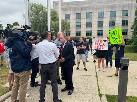 Rockland County Executive Ed Day expressed his displeasure with the plea deals outside the courthouse as firefighters and their supporters protested June 20, 2023. 