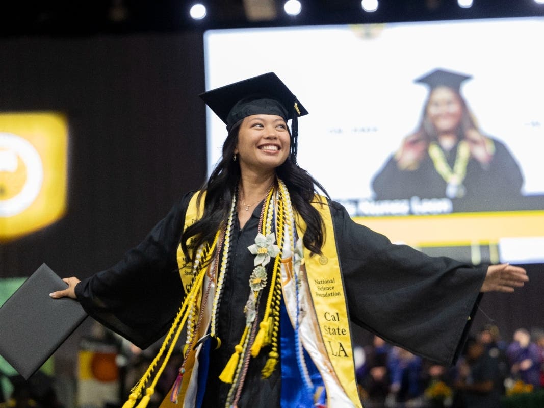 Cal State LA student Trisha Panganiban receives her bachelor's degree in biology with magna cum laude honors during Commencement 2024.