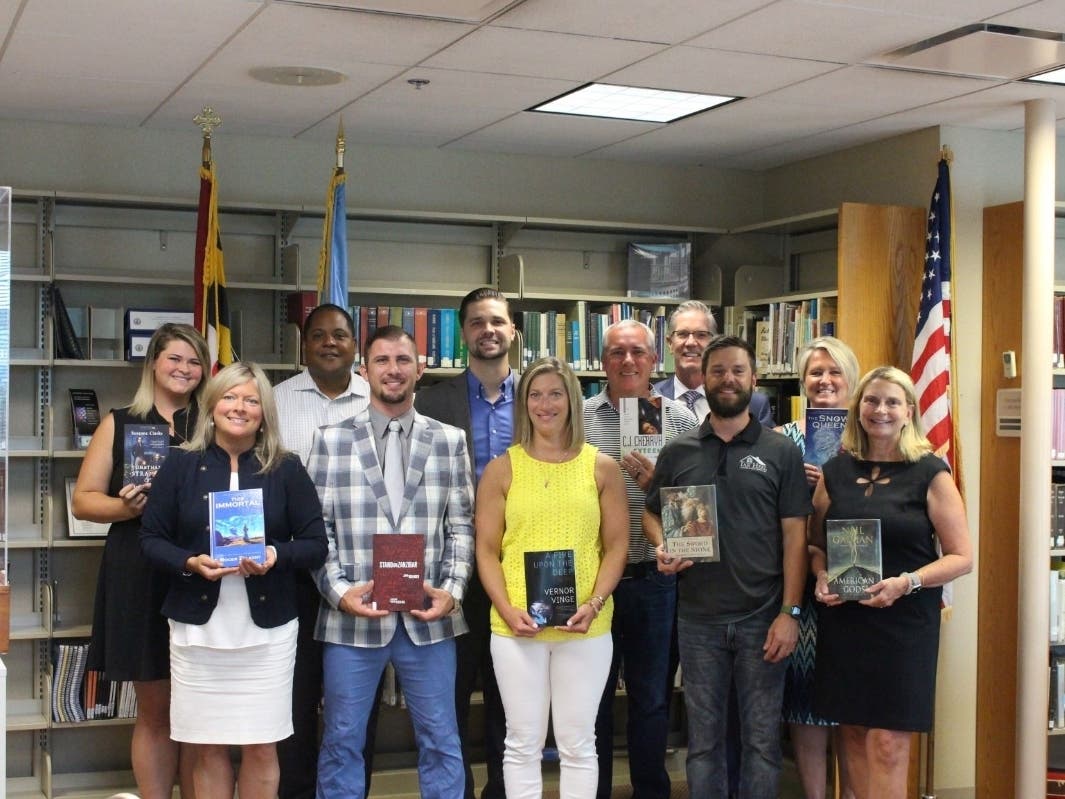Ten members of the Harford County business community donated 67 books to Harford County Public Library. 