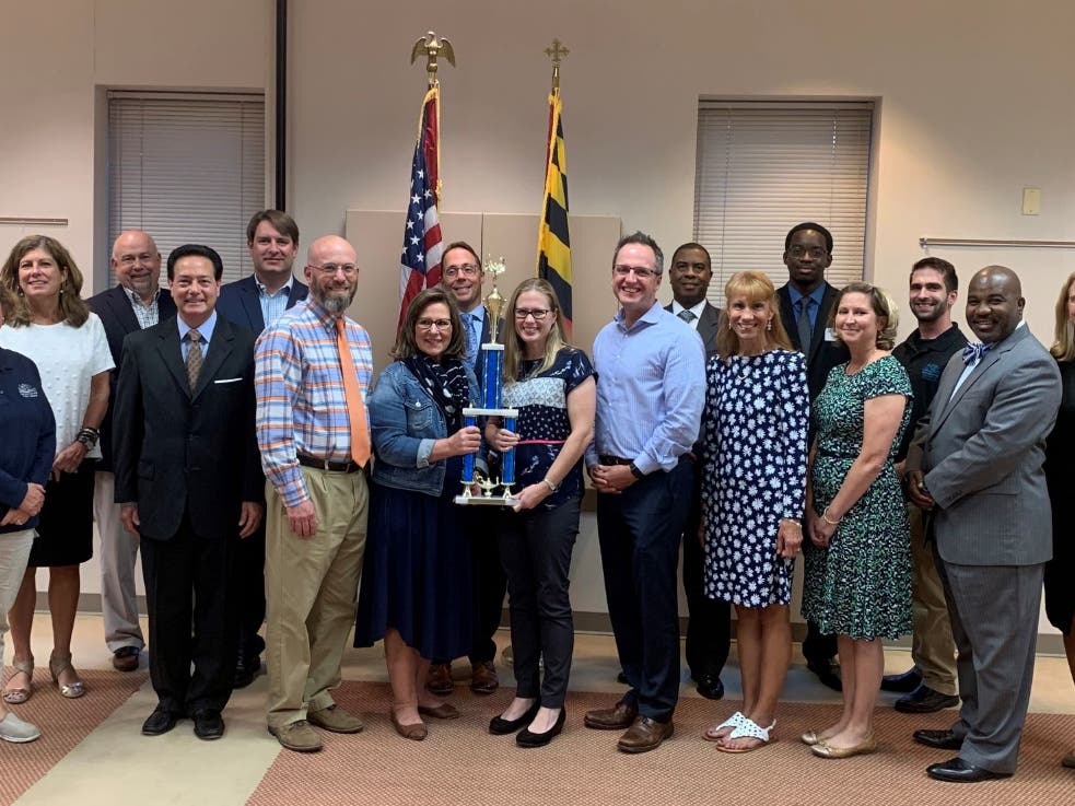 Members of Patterson Mill High School receive their Summer Reading Challenge trophy from Harford County Public Library.