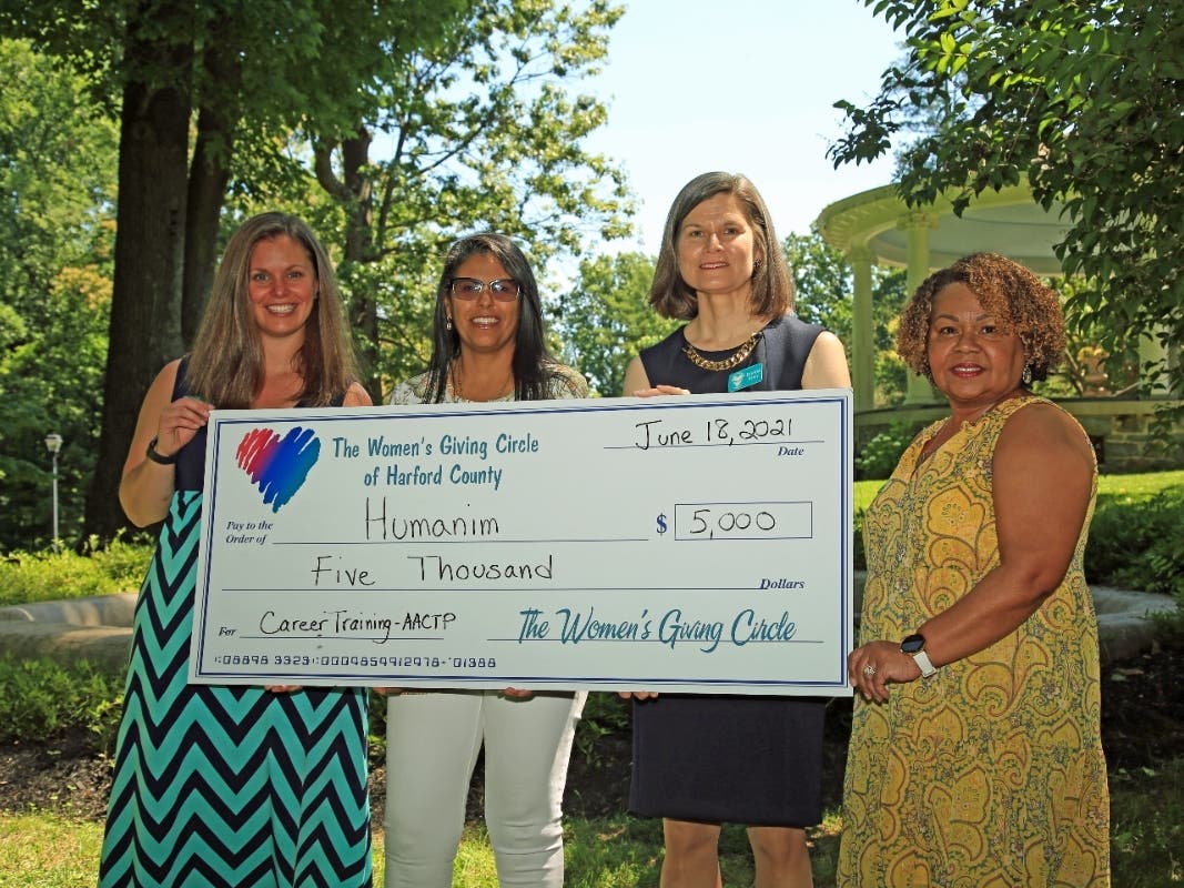 Women's Giving Circle of Harford County Grant Committee co-chair Sara Burley presents a check for $5,000 to Marisol Rodriguez from Humanim. Joining them are Donna Kreis, chair of the Women's Giving Circle, and Grant Committee co-chair Sarah Ortiz-Brown. 
