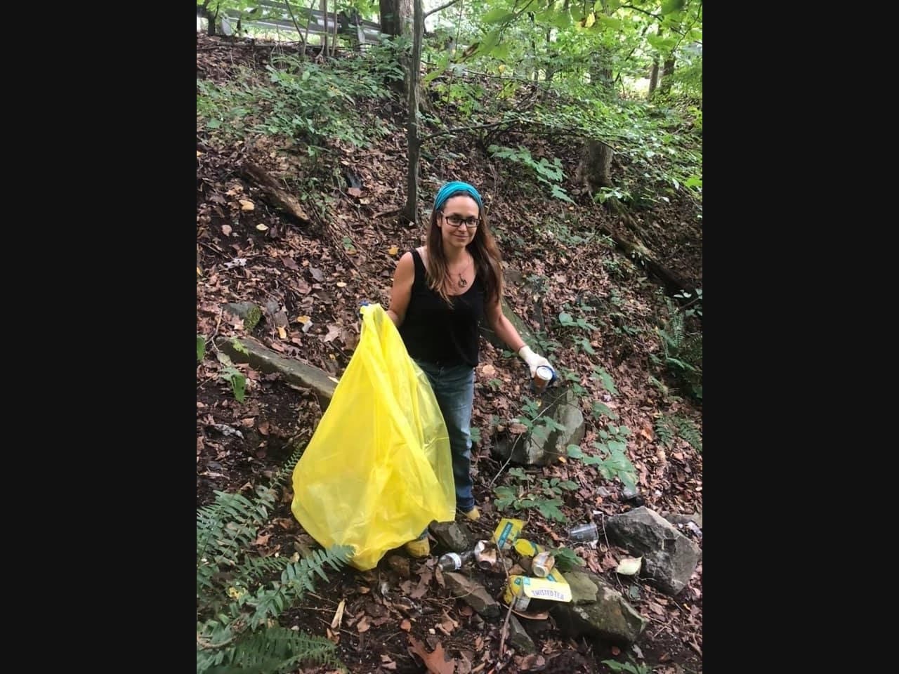 Volunteer Nicole Zahour collects trash and debris at the Conowingo Creek Boat Launch during River Sweep on September 18.