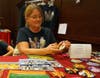 Monica Sayre of Wings of Discovery shows her nature-inspired fabric purse selection. Shoppers can receive a tax deduction with their purchase.  