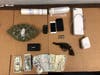 Cash, drugs and a stolen handgun were seized following a Brooklyn Park drug arrest, police say.