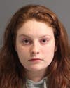 Cambria May Lynn Sieck of Brooklyn turned herself in to police on charges of accessory after the face.