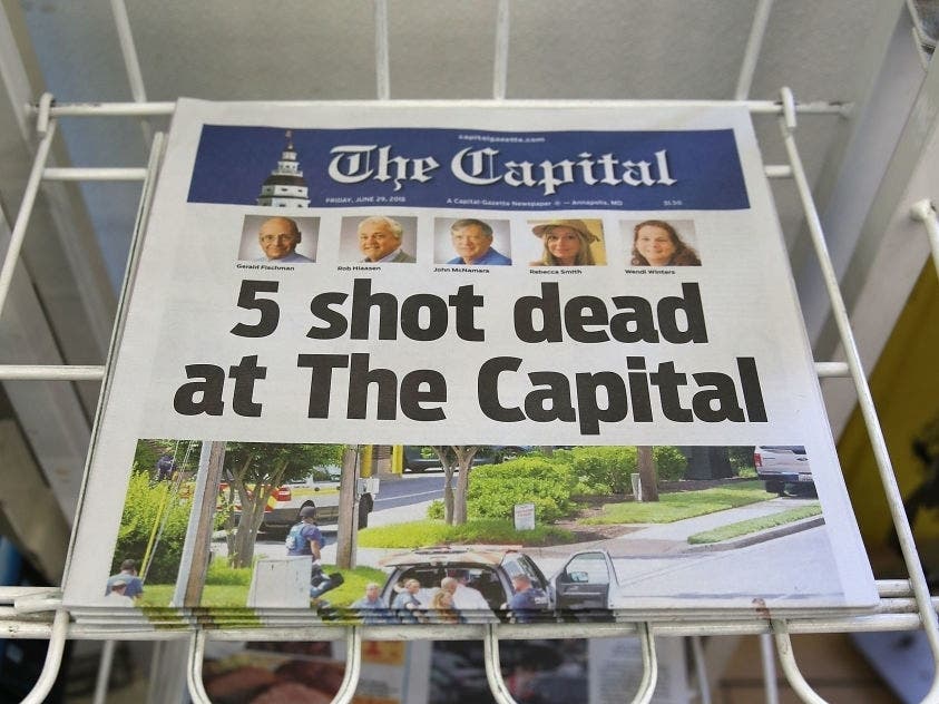 The Capital Gazette on a newspaper stand one day after a gunman killed five people in the Annapolis office in 2018.