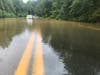 A car was trapped in high water on Woodburn Road in Fairfax County, near Inova Fairfax Hospital on Tuesday morning after heavy rains from Tropical Storm Isaias.