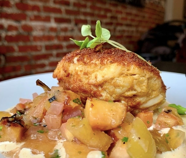 The new executive chef at Level - A Small Plates Lounge in Annapolis came from the Food Network. Crab cakes are a specialty of the house.