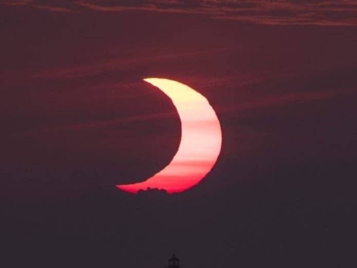 The "Ring of Fire" partial eclipse Thursday morning was a surreal show over Maryland, and residents caught some great photos of it.