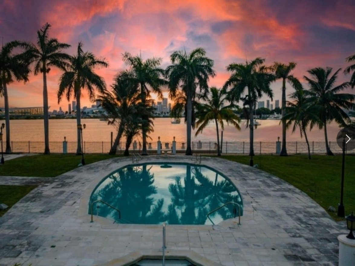 This Star Island estate sits on 2 acres in a gated community and offers 20,000 square feet of grandeur, including an elevator. A private dock overlooks Miami's skyline.