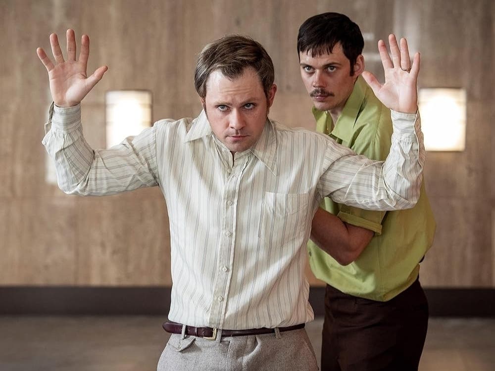 Bill Skarsgård and Dacre Montgomery in "Dead Man's Wire."