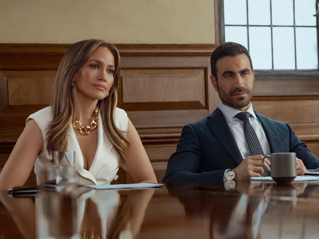 (L-R) Jennifer Lopez as Jackie Cruz and Brett Goldstein as Daniel Blanchflower in "Office Romance."